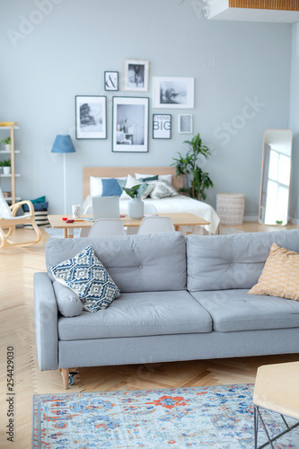 Home interior in daylight. Furniture and decor in Scandinavian style. 