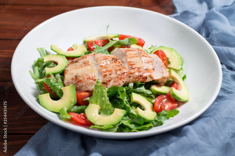 Mix salad with grilled chicken, avocado, tomatoes Mix salad with grilled chicken, avocado, tomatoes
