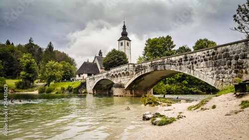 Church and bridge on Bohinj lake in Slovenia near the Triglav mountain adn part of Triglav national pak
