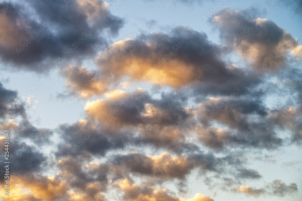 Yellowish clouds against blue sunset sky Yellowish clouds against blue sunset sky