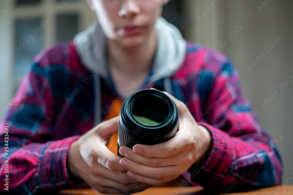 young photographic equipment repair master in a workshop young photographic equipment repair master in a workshop