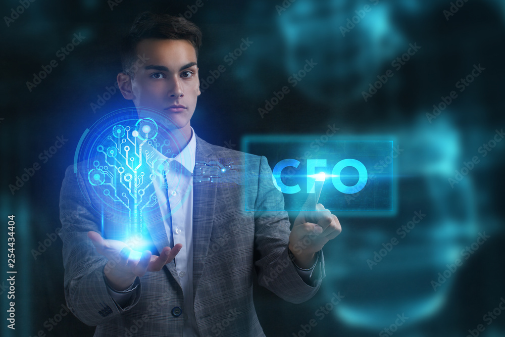 The concept of business, technology, the Internet and the network. A young entrepreneur working on a virtual screen of the future and sees the inscription: CFO The concept of business, technology, the Internet and the network. A young entrepreneur working on a virtual screen of the future and sees the inscription: CFO