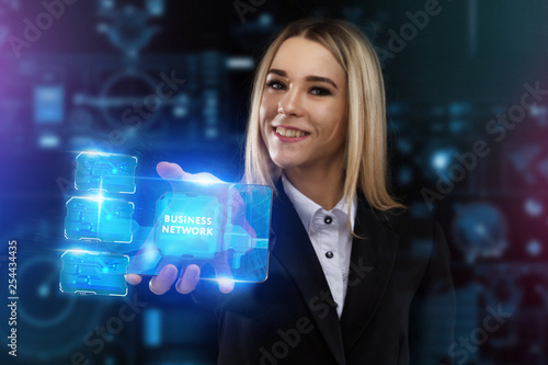 The concept of business, technology, the Internet and the network. A young entrepreneur working on a virtual screen of the future and sees the inscription: Business network
