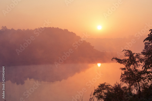 beautiful pink sunruse under river. India landscape photo