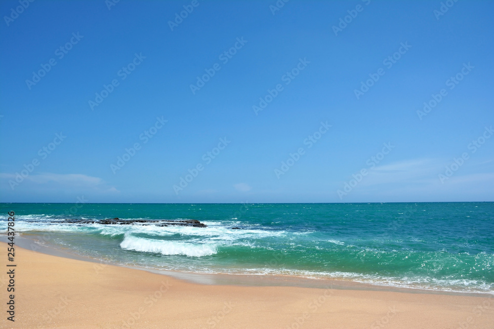 Ocean waves with white caps breaking on the shore. Indian Ocean, Sri Lanka