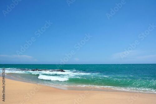Ocean waves with white caps breaking on the shore. Indian Ocean  Sri Lanka
