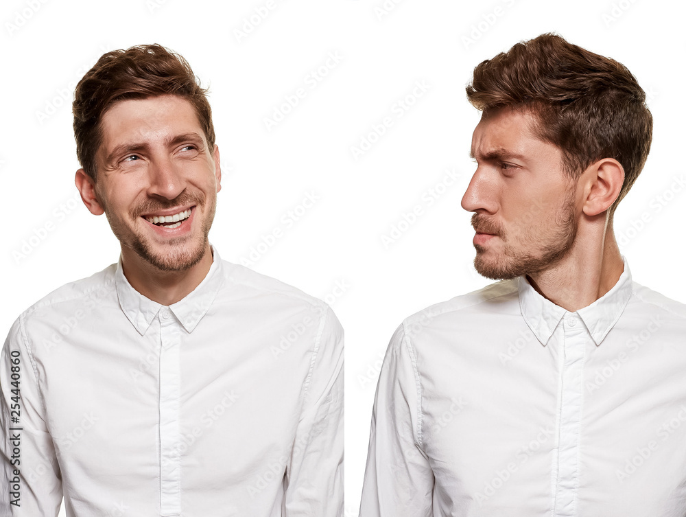 Handsome man in a white shirt makes faces, isolated on a white background Handsome man in a white shirt makes faces, isolated on a white background