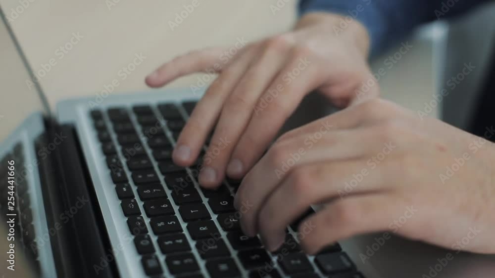 Close up male hands typing on keyboard Blurry background. Fingers on keyboard. Camera is moving Close up male hands typing on keyboard Blurry background. Fingers on keyboard. Camera is moving