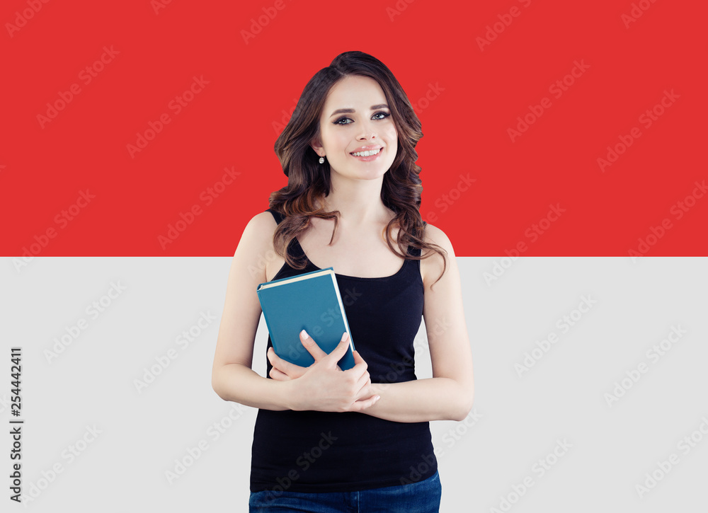 Portrait of smiling brunette woman with the Monaco flag Portrait of smiling brunette woman with the Monaco flag