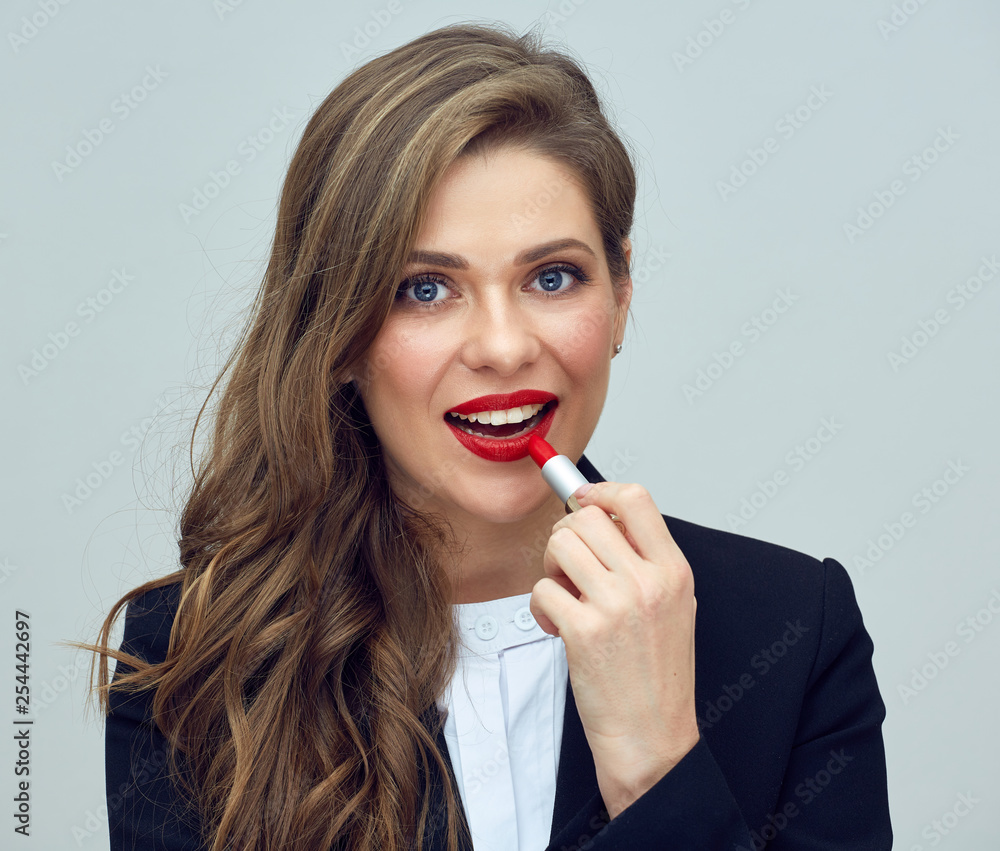 business woman with curly hair holding red lipstick. business woman with curly hair holding red lipstick.