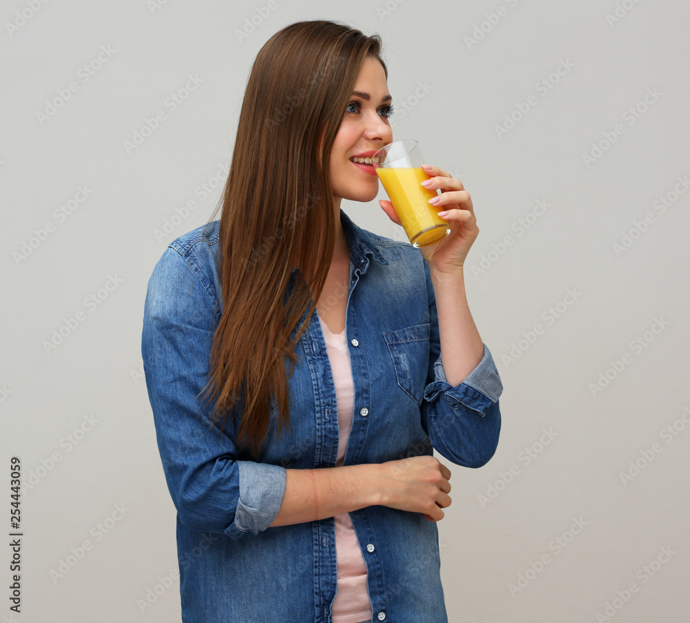 Happy woman drinking orange juice. Happy woman drinking orange juice.
