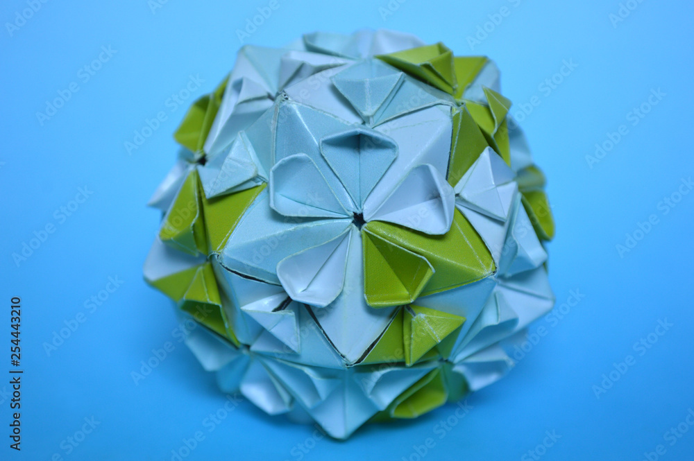 Modular origami, cherry blossom, on blue background Modular origami, cherry blossom, on blue background