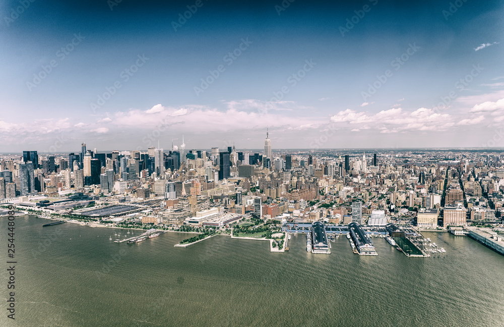 Amazing aerial view of New York City. Midtown Manhattan skyline from helicopter on a sunny afternoon