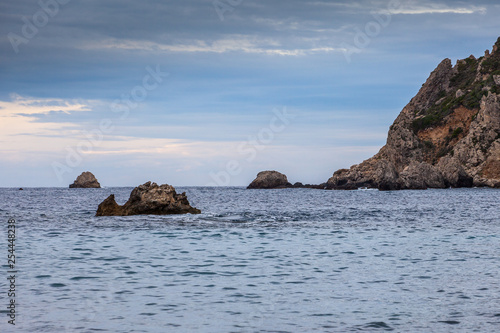 Paleokastritsa bay cliffs and rocks on a cloudy day © Gianluca