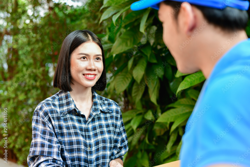 Business concept. The young man cares about the parcel delivery to the customers safely. Transportation of products that focus on customer satisfaction services. Business concept. The young man cares about the parcel delivery to the customers safely. Transportation of products that focus on customer satisfaction services.