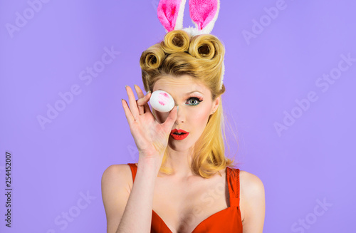 Happy Easter! Easter day. Spring holiday. Woman with rabbit ears holds white eggs. Egg hunt. Easter bunny. Easter concept. Woman witn bunny ears. White eggs. Bunny girl. Kiss.