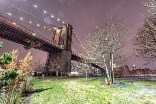 The Brooklyn Bridge at night. Winter landscape from Brooklyn Bridge Park, New York City