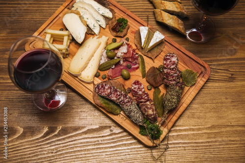 Cheese, sausages and red wine as an appetizer
