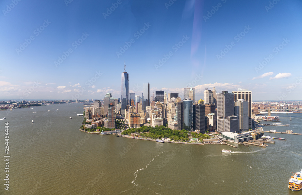 Amazing aerial view of New York City. Lower Manhattan skyline from helicopter on a sunny afternoon