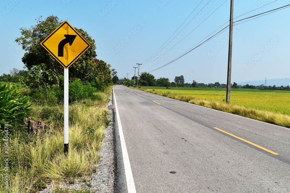 old and dirty traffic signs beside asphalt road in countryside old and dirty traffic signs beside asphalt road in countryside