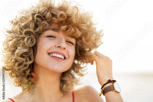 Portrait of young woman with curly hair photo