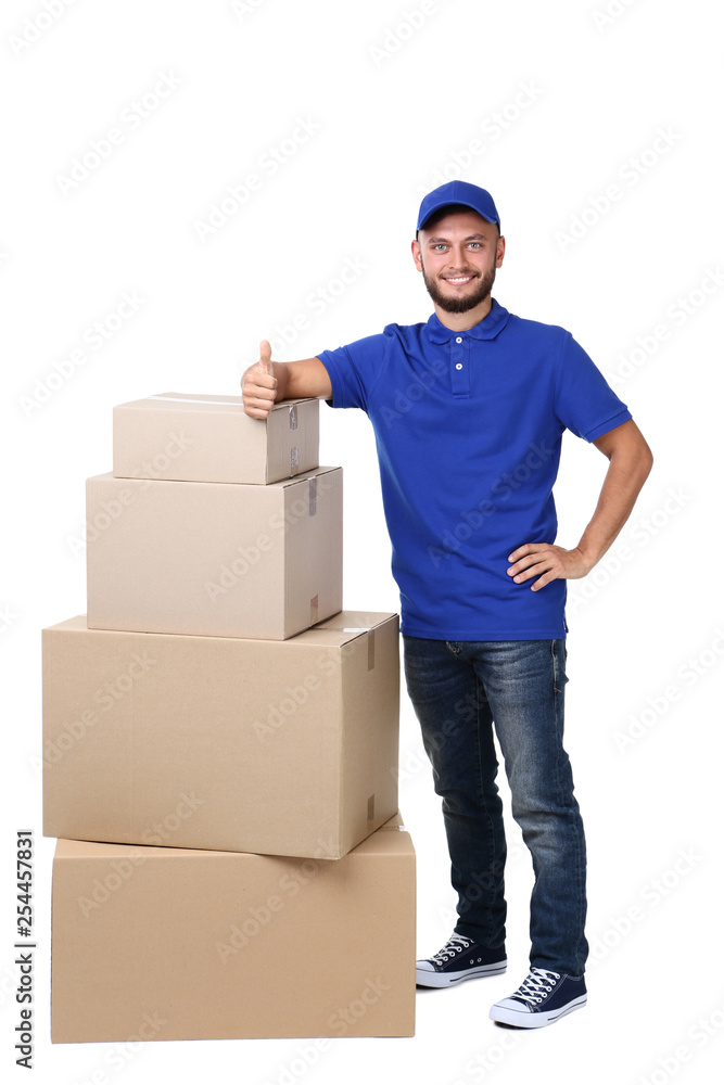 Delivery man with cardboard boxes isolated on white background Delivery man with cardboard boxes isolated on white background