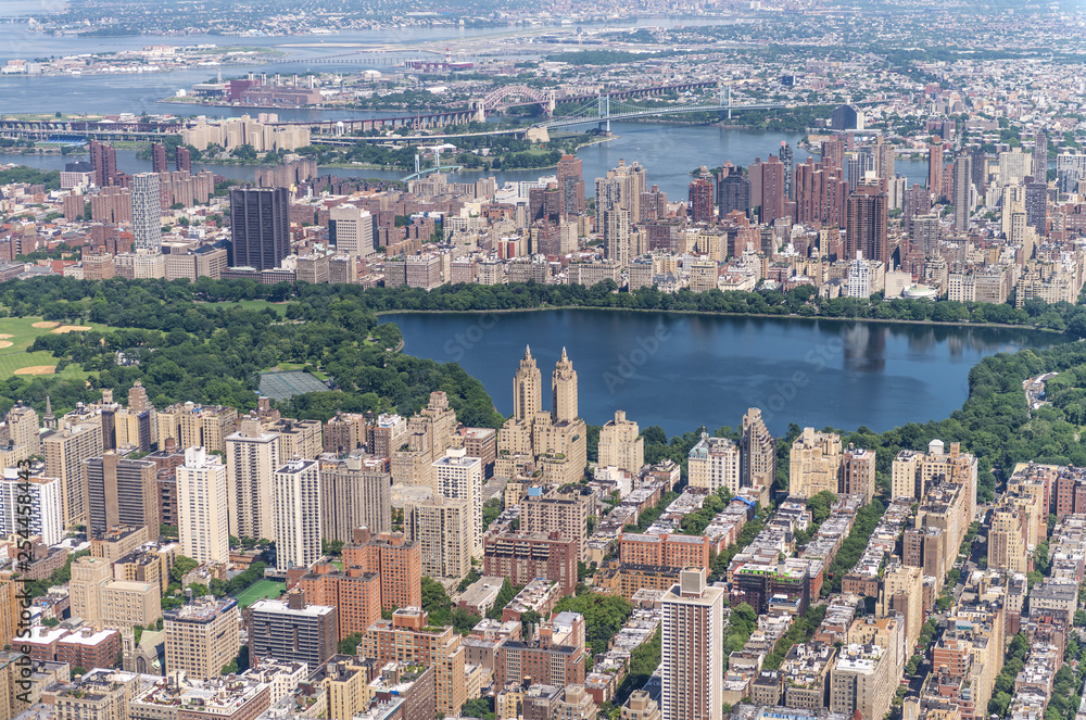 Manhattan skyline and Central Park Lake from the helicopter on a sunny afternoon