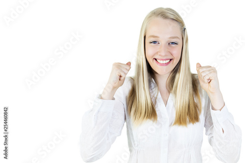 happy young woman with clenched fist smiling at camera, isolated on white