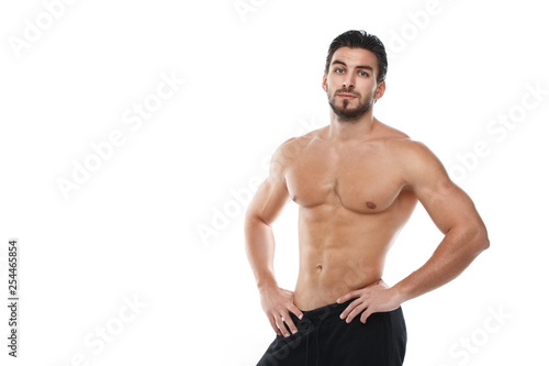 Sexy athletic man with a naked torso isolated on white background.
