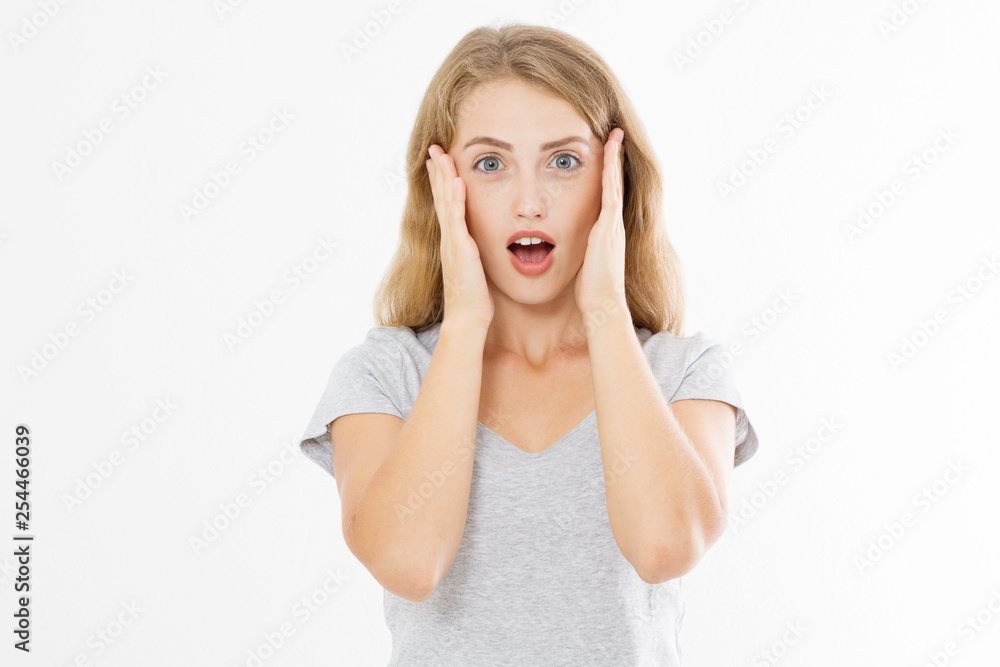Surprised shocked excited caucasian woman wow face isolated on white background. Young girl in summer t shirt. Copy space Surprised shocked excited caucasian woman wow face isolated on white background. Young girl in summer t shirt. Copy space