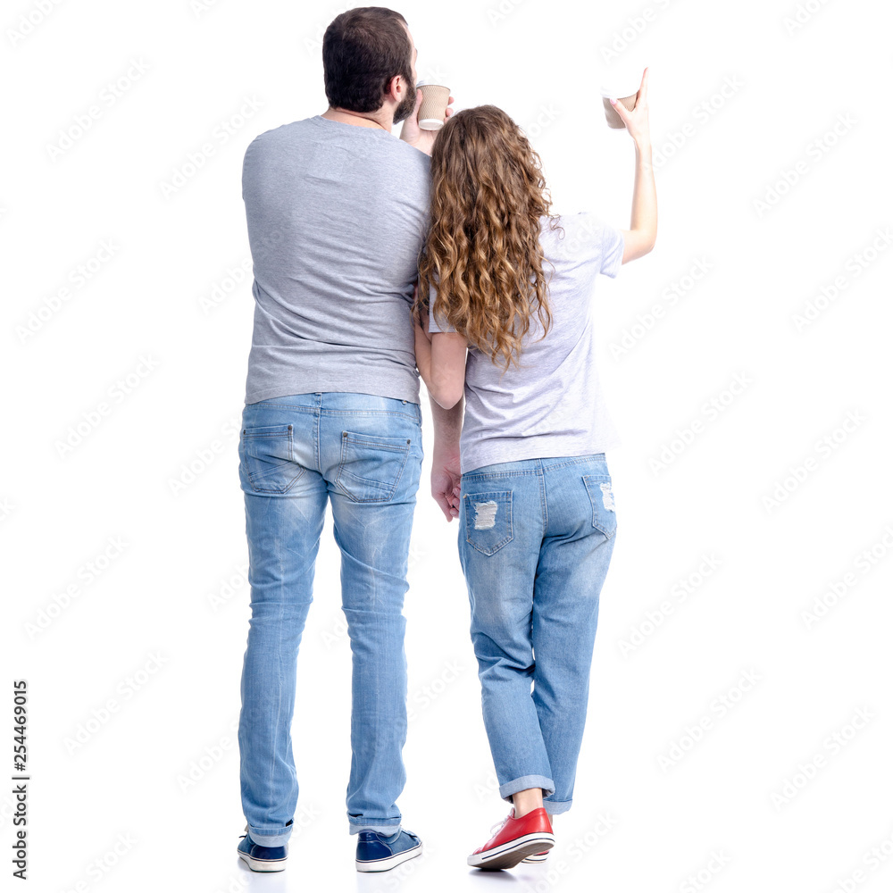 Woman and man in jeans standing looking showing, with cardboard cup of coffee in hand on white background isolation, rear view Woman and man in jeans standing looking showing, with cardboard cup of coffee in hand on white background isolation, rear view