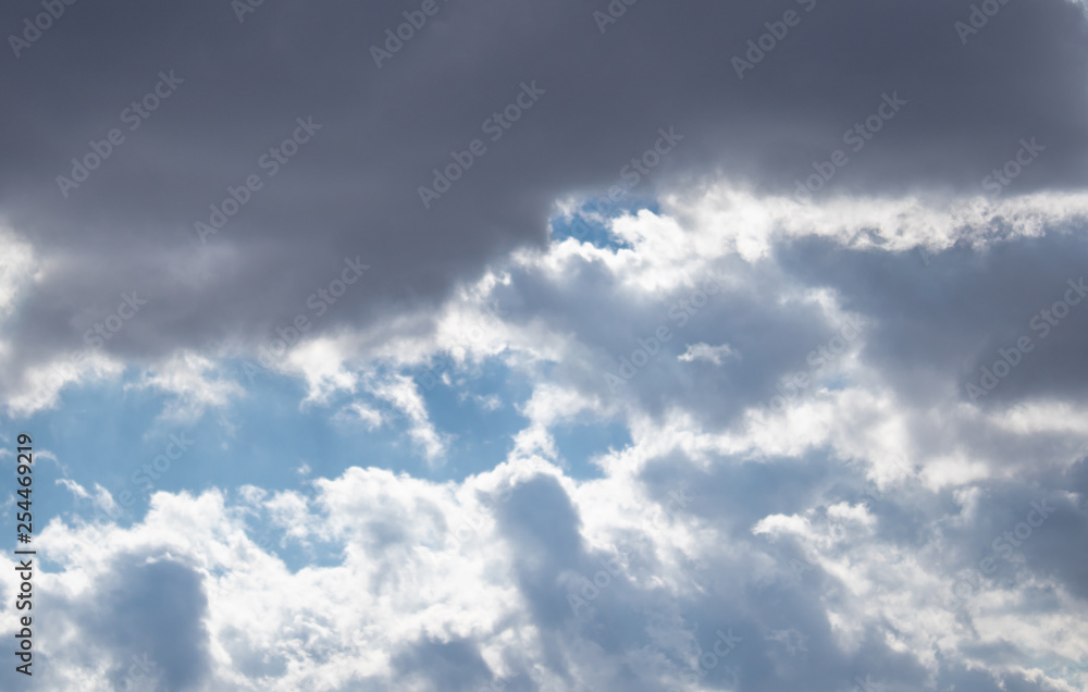 Fototapeta premium Dark air clouds in the blue sky.