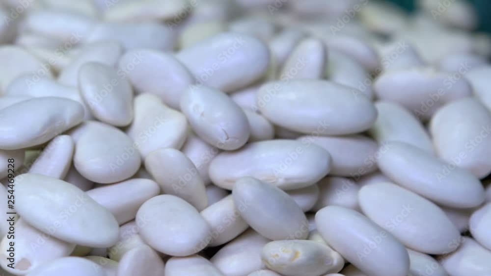Close-up white beans on the wooden table, vegetable food, 360 rotation
