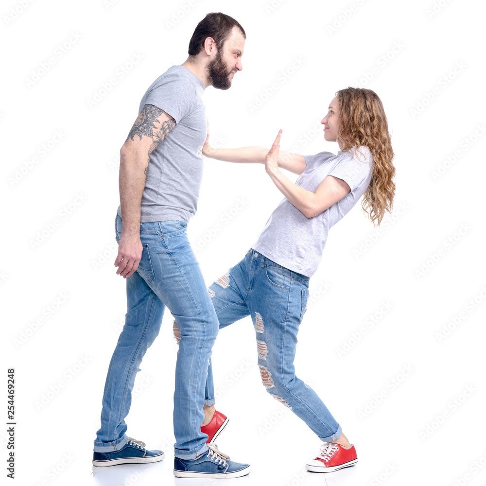 A man is angry at a woman on a white background. Isolation A man is angry at a woman on a white background. Isolation