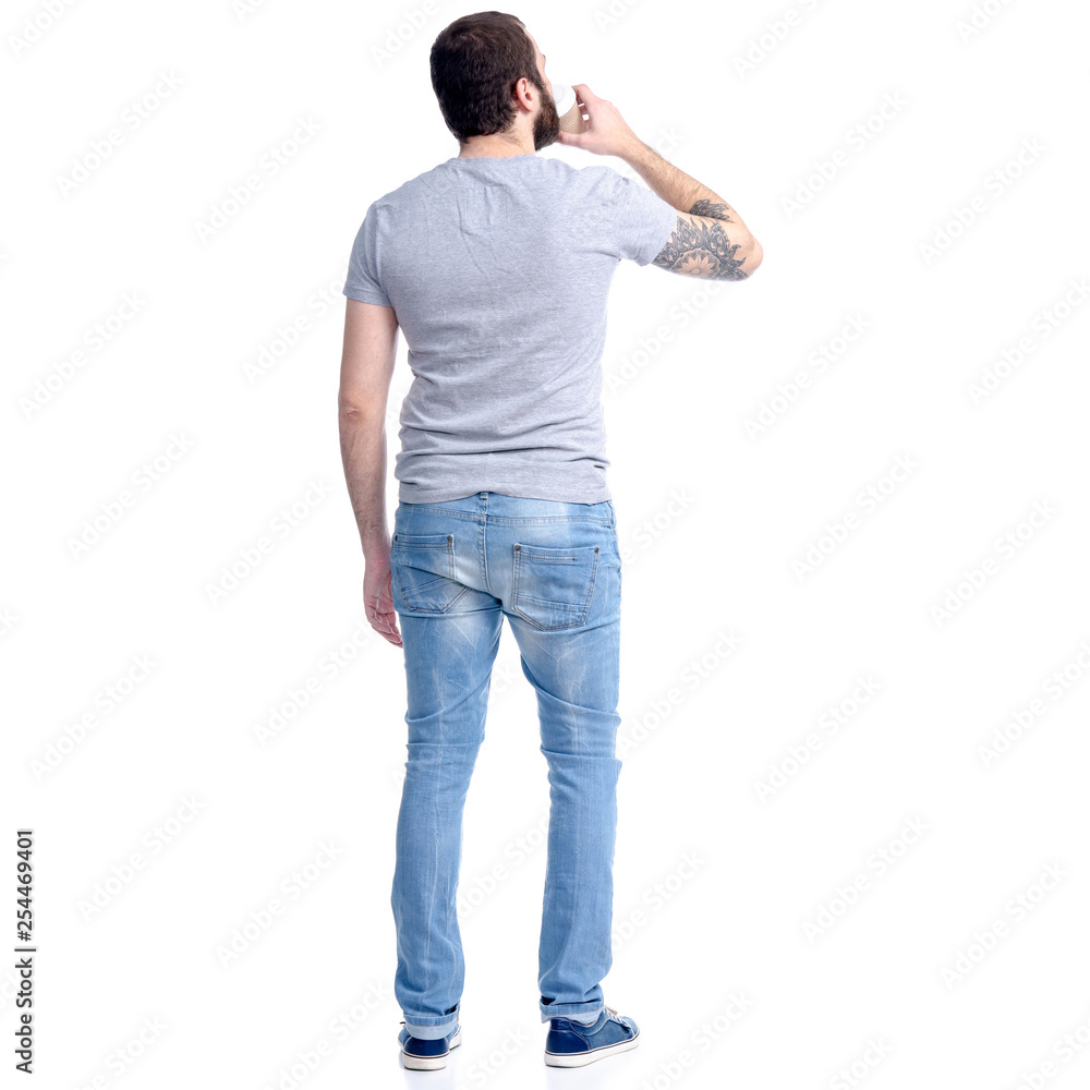 Man with cardboard cup of coffee in hand drinking on white background isolation, back view Man with cardboard cup of coffee in hand drinking on white background isolation, back view