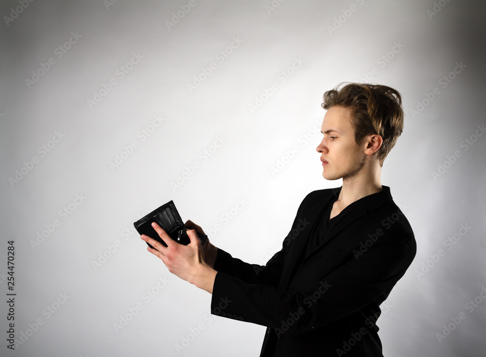 Young man and empty wallet Young man and empty wallet