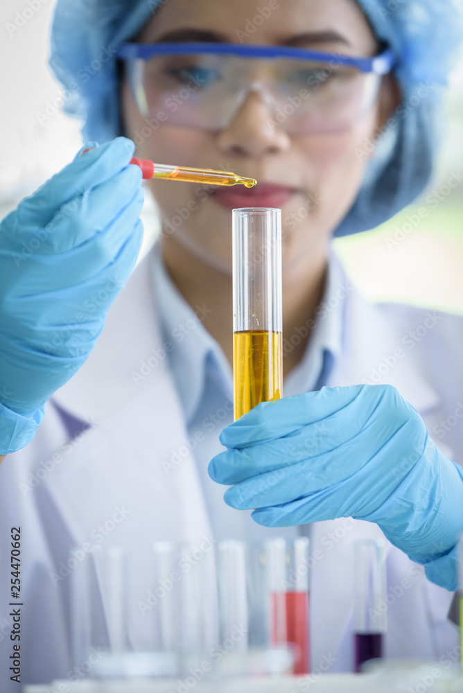 Asian young girl student scientist researching and learning in a laboratory. Asian young girl student scientist researching and learning in a laboratory.