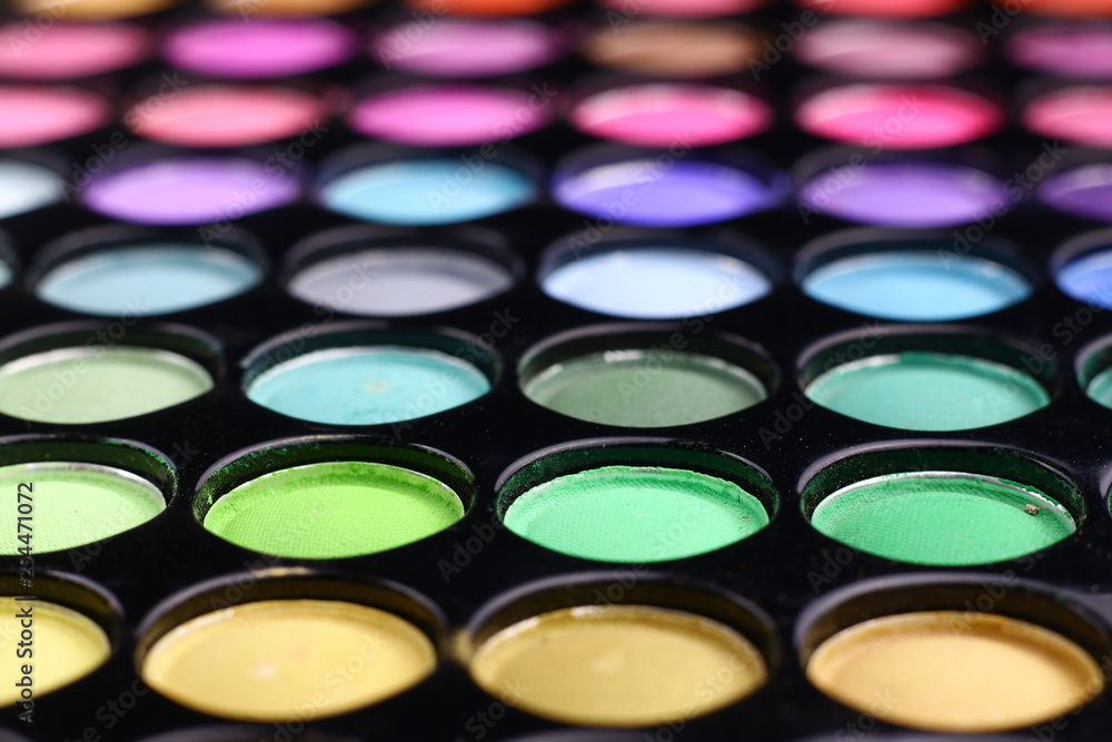 Different tonic green, light blue and purple make-up powder. Different tonic green, light blue and purple make-up powder.