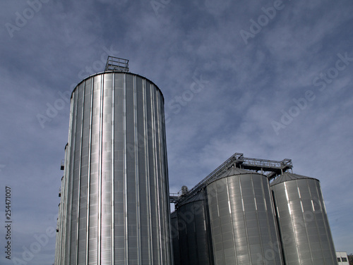 silos and blue sky,industry, silo, storage, tank, factory, sky, metal, industrial, plant, grain, steel, agriculture,cylinder