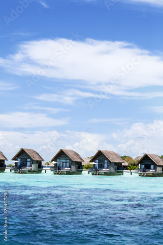 Over water bungalows at a Maldives island resort 