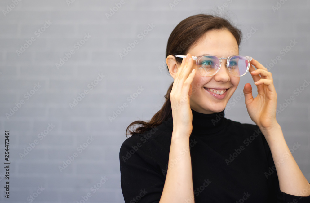 Portrait of a young smiling woman with eyeglasses Portrait of a young smiling woman with eyeglasses