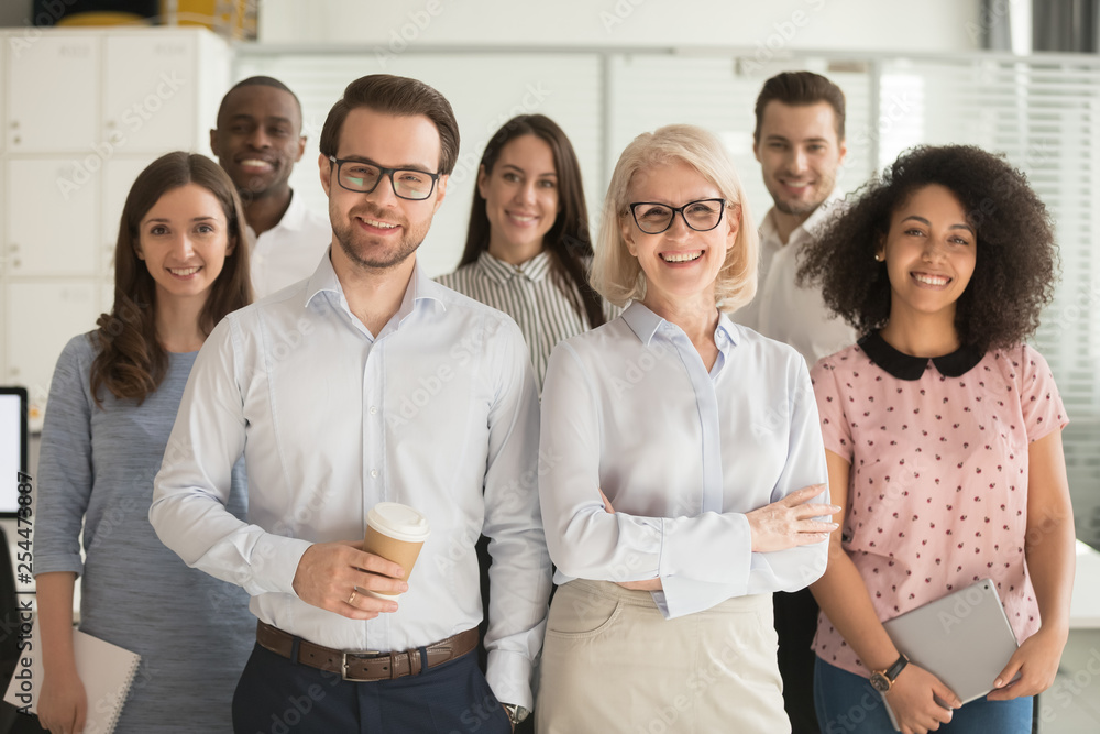 Smiling professional business leaders and employees group team portrait - obrazy, fototapety, plakaty 