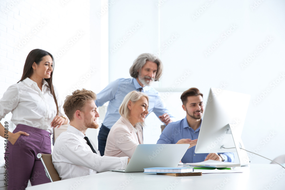 Business people discussing work matters at table in office. Professional communication Business people discussing work matters at table in office. Professional communication