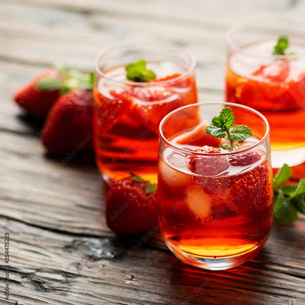 Fresh summer cocktail with ice, strawberry and mint Fresh summer cocktail with ice, strawberry and mint