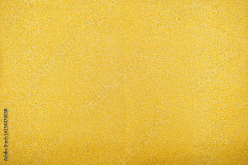 The texture of the gold color of different textures. Ready universal background for any project. Primary color trend. Horizontal. Flat lay,