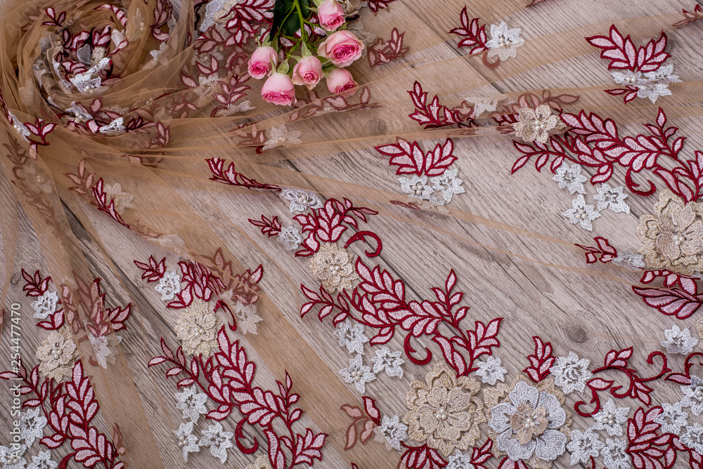 The texture of lace on wooden background The texture of lace on wooden background