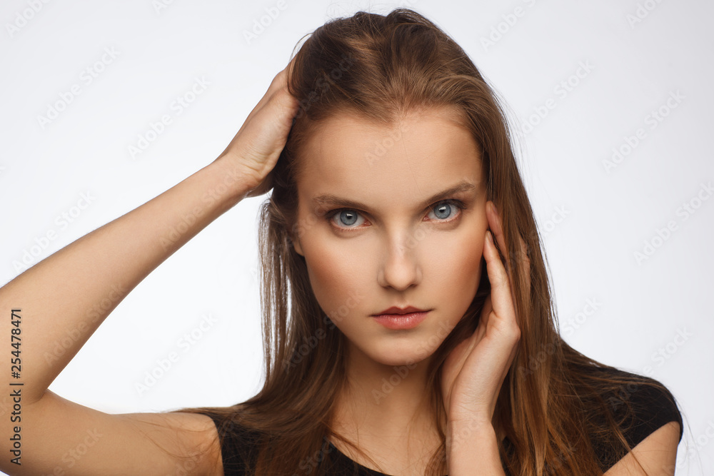 Portrait of a beautiful model with strong emotion, dressed in a black dress Portrait of a beautiful model with strong emotion, dressed in a black dress