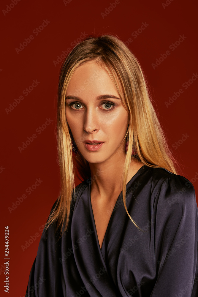 Seductive close up portrait of beautiful blonde young woman in cocktail dress Seductive close up portrait of beautiful blonde young woman in cocktail dress