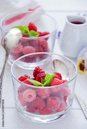 Fresh Organic Raspberries in glasses for Breakfast 