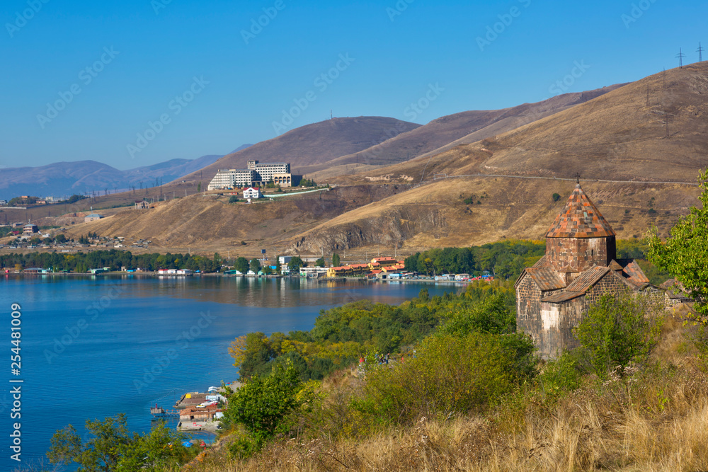 Scenic view of an old Sevanavank church in Sevan, Armenia on autumn day, blue sky